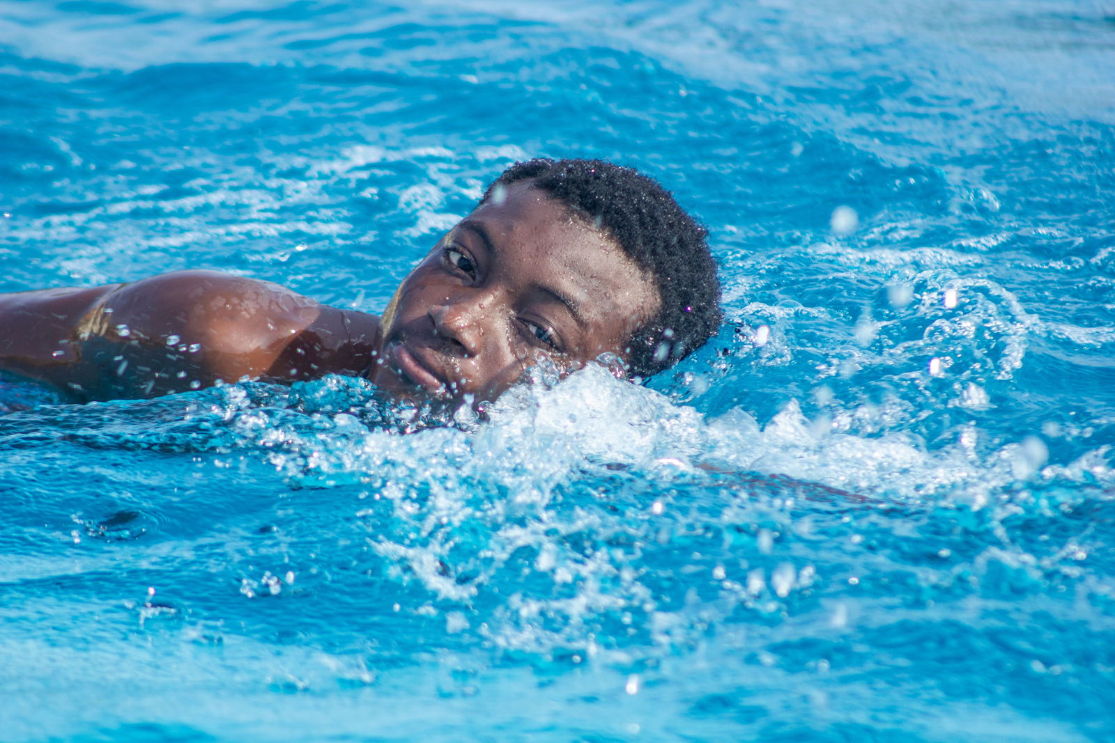 Swimmer training in an outdoor swimming pool